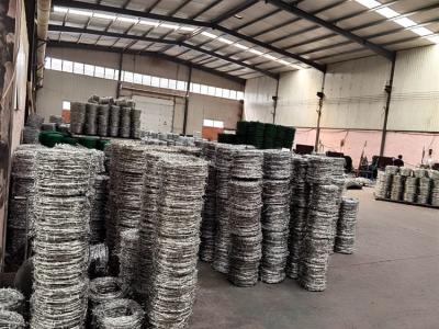 China Low Carbon Steel  12 Gauge Barbed Wire Security Fence / Coiled Barbed Wire for sale