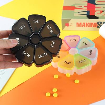 China 7 Day Weekly Pill Medicine Dispenser Box Flower Shape 7 Cases Vitamin Fish Oil 12cm for sale
