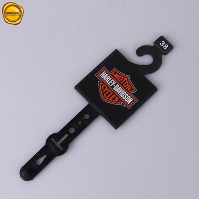 China Customized Printed Black Plastic Belt Hangers With Stickers for sale