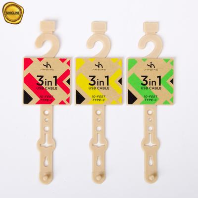 China Paper Sticker Printed Beige Plastic Belt Hangers With Tail for sale