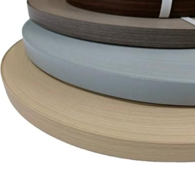 China Melamina PVC banda de borda, 0,8 mm Pre colada banda de borda de grão de madeira à venda