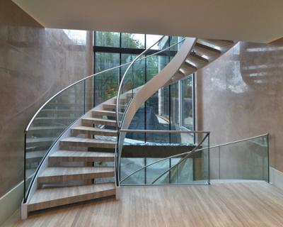 China Elegant interior wooden curved staircase with 50mm solid oak wooden treads for sale