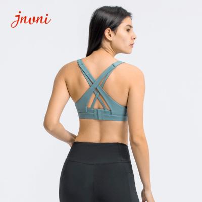 China Strappy Sports Bra For Women Sexy Crisscross Back Adjustble Button Yoga Running Athletic Gym Workout Fitness Tops for sale