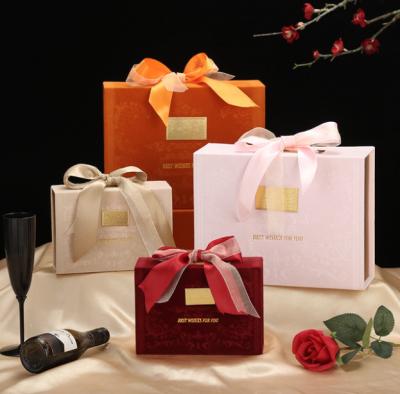China Velvet Book Shaped Paper Gift Box Self Erecting Cardboard Packaging Red Pink Orange for sale
