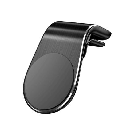 China L tipo cojín móvil magnético del silicón del metal del tenedor del teléfono del clip de la rejilla de ventilación de coche en venta