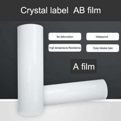中国 紫外線移動ののりプリンターABフィルムの水晶ラベルはよりよいプリンターを貼る 販売のため