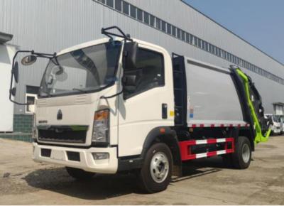 中国 Truck Trader Commercial Vehicles 8m³ Loading 4×2 Drive Mode HOWO Compressed Garbage Truck 7.5 Meters Long 販売のため