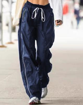 中国 少しの衣料メーカーの女性の長い偶然のジッパーのポケットが付いている100%のポリエステル緩いズボン 販売のため