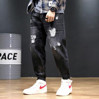 China Customized Logo Polyester Haren Nine Point Pants Loose Dark Blue Jeans for sale