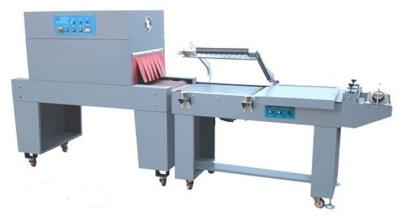 China Semi Automated Packaging Machine BOPP Film Shrinking Film Wrapping Equipment for sale