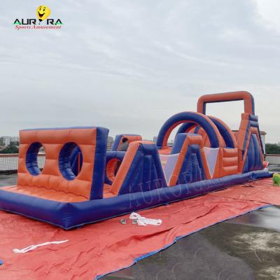 China Pvc exterior inflável curso de obstáculos casa de salto não tóxico vermelho azul cor à venda