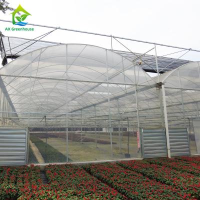 China Dome Arch Multi Span Plastic Film Greenhouse For Large Area Farm Growing for sale