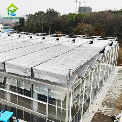 China Automatic Control Intelligent Agricultural Glass Greenhouse With Shading System for sale
