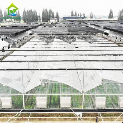 China Saw Tooth Multi Span Tropical Weather Plastic Film Greenhouse With Shading System for sale