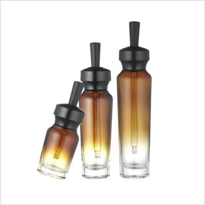China garrafa luxuosa do conta-gotas do vidro de 15ml 30ml 50ml com o conta-gotas da garrafa de óleo essencial do tampão à venda