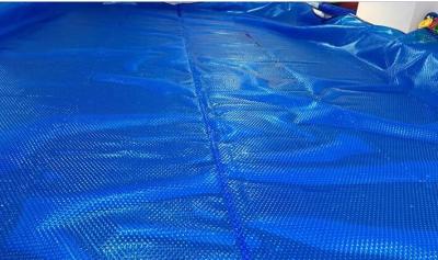 China Bubble Swimming Pool Solar Blanket Save Warmth And Evaporation 12mm Diameter Swimming Pool Cover Reel for sale