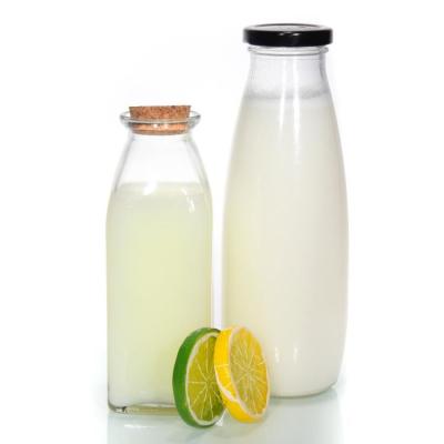 China Botella de leche de vidrio reciclable de 500 ml con tapa de aluminio con agujero de paja en venta