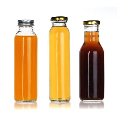 China 200 ml 250 ml botellas de jugo de vidrio de 16 oz contenedor de kombucha a granel en venta