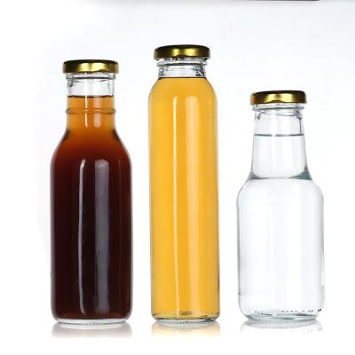 China Flasca de vidrio de jugo de frutas vacío a granel 12 oz 350 ml para bebida en venta