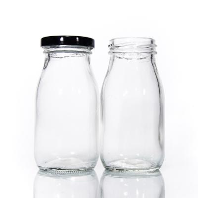 China Embalaje de bebidas en botellas de vidrio reciclado de leche de 200 ml OEM en venta