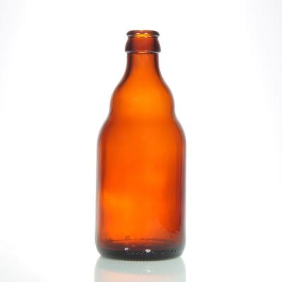 China Botellas de cerveza de vidrio a granel carbonatadas 330 ml 12 oz transparente en venta