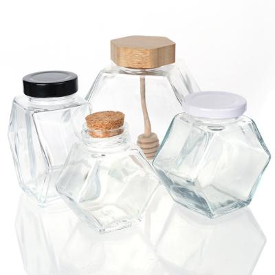 China 100ml 220ml Hexagonal Glass Food Jars With Lids Dipper for sale