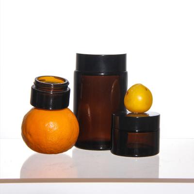 China ODM Colored Cosmetics Glass Cream Jars With Golden Acacia Lid for sale