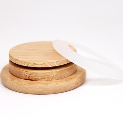 China Venta al por mayor tapas de bambú con agujero de paja de madera personalizada 16 oz tapa de frasco de vidrio Mason en venta