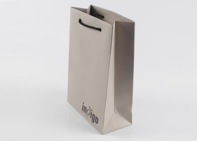 China Eco Friendly Paper Shopping Bags With Nylon Rope Handles And Spot UV Surface Finishing for sale
