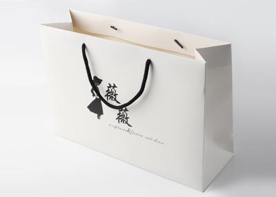 China Matte Laminated White Paper Shopping Bags With Cardboard Bottom Insert for sale