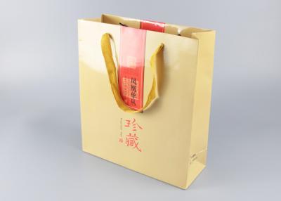 China Sacos de compras de papel superiores laminados lustrosos com os punhos da fita do algodão à venda