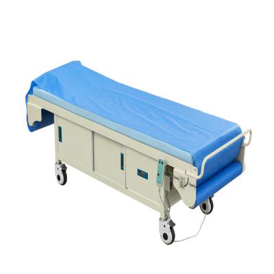 China Automático hospital paciente de la cama de la sábana de cambio del examen del sofá con el gabinete ODM equipo médico duradero en venta