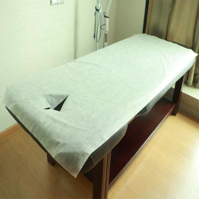 China Dispoable Spunbond Non Woven Massage Table Bed Sheet With Facial Hole Pink Blue Color for sale
