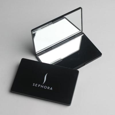 China Espejos bilaterales de escritorio del maquillaje del viaje con la superficie y el botón de epoxy en venta