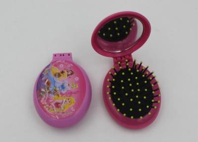 China Fashsion Oval Shape 2 In 1 Folding Travel Hair Brush With Mirror And Comb for sale