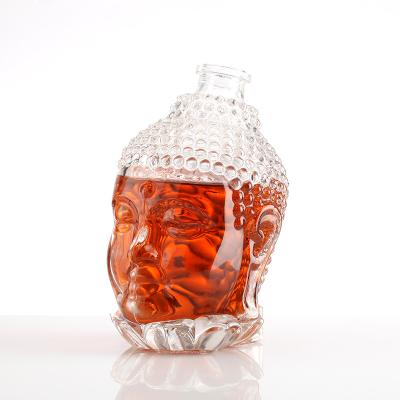 China Aluminum Plastic PP Collar 750ml Clear Glass Spirits Bottle in Unique Buddha Shape Design for sale