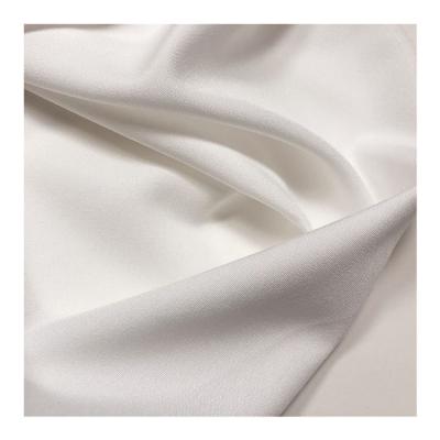 China 100d Woven Polyester Spandex Fabric With Elastic White Fabric For Trousers And Shirts for sale