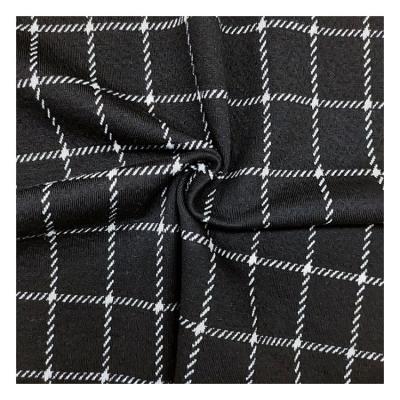 China Custom Plaid Pattern Polyester Spandex Jacquard Knitted Fabric Garment Soft Fabric en venta
