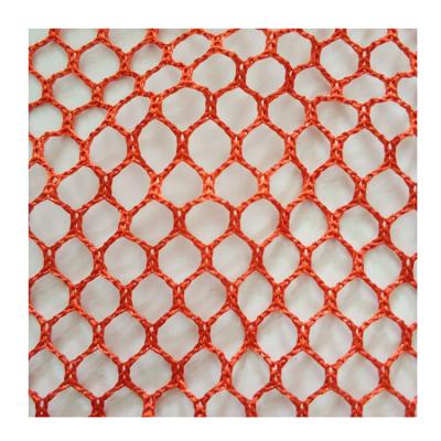 China Large Polyester Stain Repellent Fabric Bright Silk Knitted Hexagonal Mesh Fabric à venda