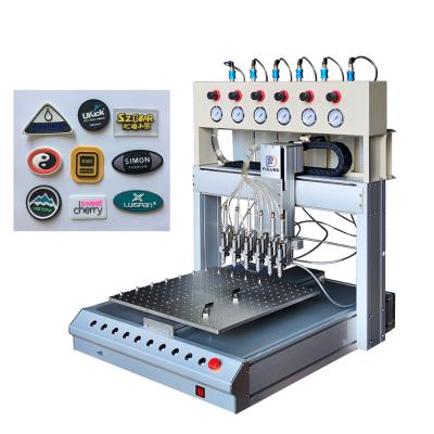China 3d Rubber Patch Pvc Label Dispensing Machine Full Automatic for sale
