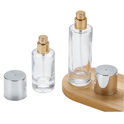 China Transparent Glass Foundation Bottle with Screw Cap 100ml Round Shape Simple Design en venta