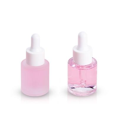 China Simple Round Glass Foundation Bottle with Free Samples Transparent Glossy Finish en venta