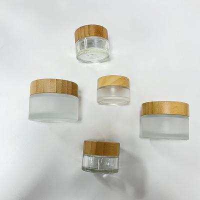 中国 5g To 100g Frost Transparency Glass Cream Jar Wooden Lids Screw Mouth 販売のため