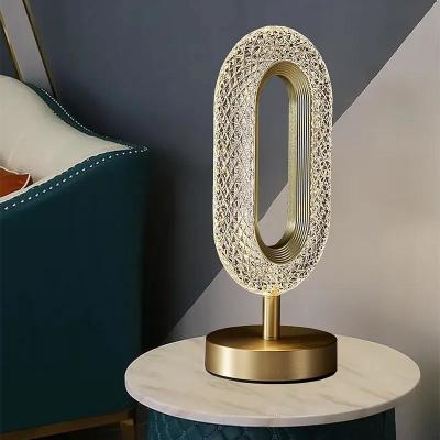China Modern Bedroom Bedside Table Lamp Gold Acrylic Metal LED Table Lamp for sale