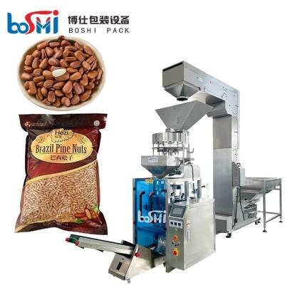 Chine La tasse volumétrique automatique dosant les arachides a séché la machine à emballer de granule de nourriture d'écrous à vendre