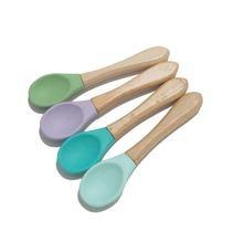 China Wooden Handle Infant Feeding Spoon BPA Free Food Grade Soft Silicone Baby Spoon for sale