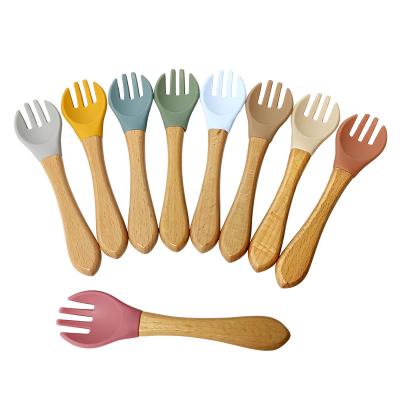 China Bpa Free Infant Kids Wooden Handle Fork Set Silicone Baby Spoon for sale