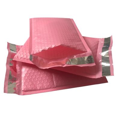 China saco plástico acolchoado do correio dos encarregados do envio da correspondência da bolha do selo do auto do rosa 9x12 quente envoltório poli à venda