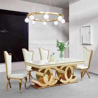 China Golden Base 40mm Stainless Steel Dining Table 8 Seater Marble Dining Table for sale