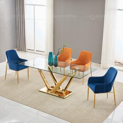 China Rectangular Width 35inch Tempered Glass Dining Table Gold Metal Legs for sale